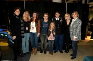 (L-R) John McFee, Crystal Arnold, Aolani Arnold, Hunter Hayes, Kaelynn Arnold, Sergeant First Class Tyler Arnold, Kellie Pickler, and CMA Chief Executive Officer Sarah Trahern Photo Credit: Rick Diamond/Getty Images